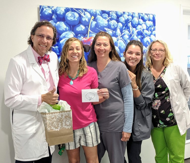 A group photo of a happy patient and the team at Fertility Center Florida