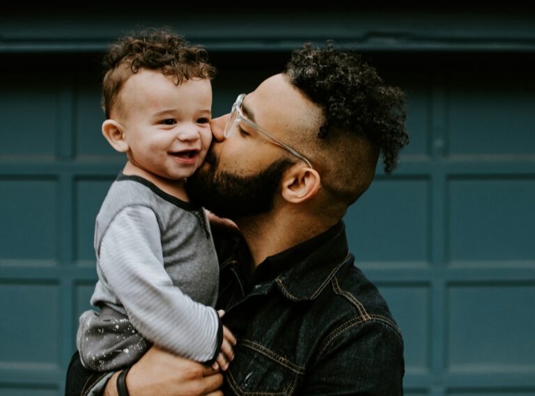 Blog 1 Happy father kisses a baby